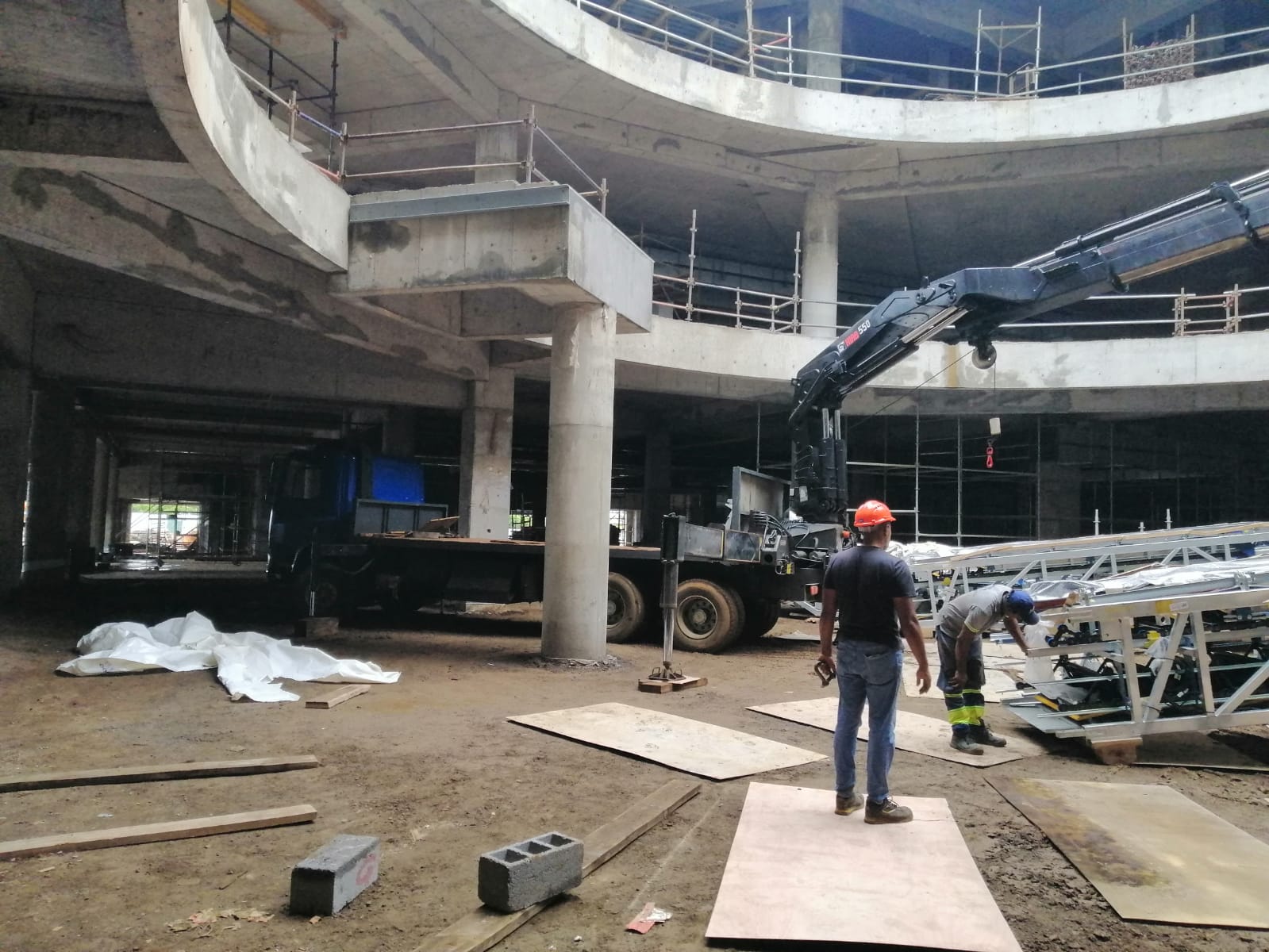 HIAB truck crane working inside a building under construction