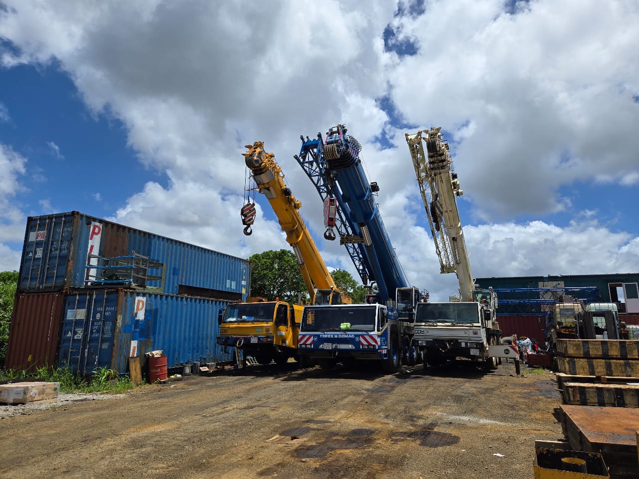 Three JSTL cranes lined up in the yard
