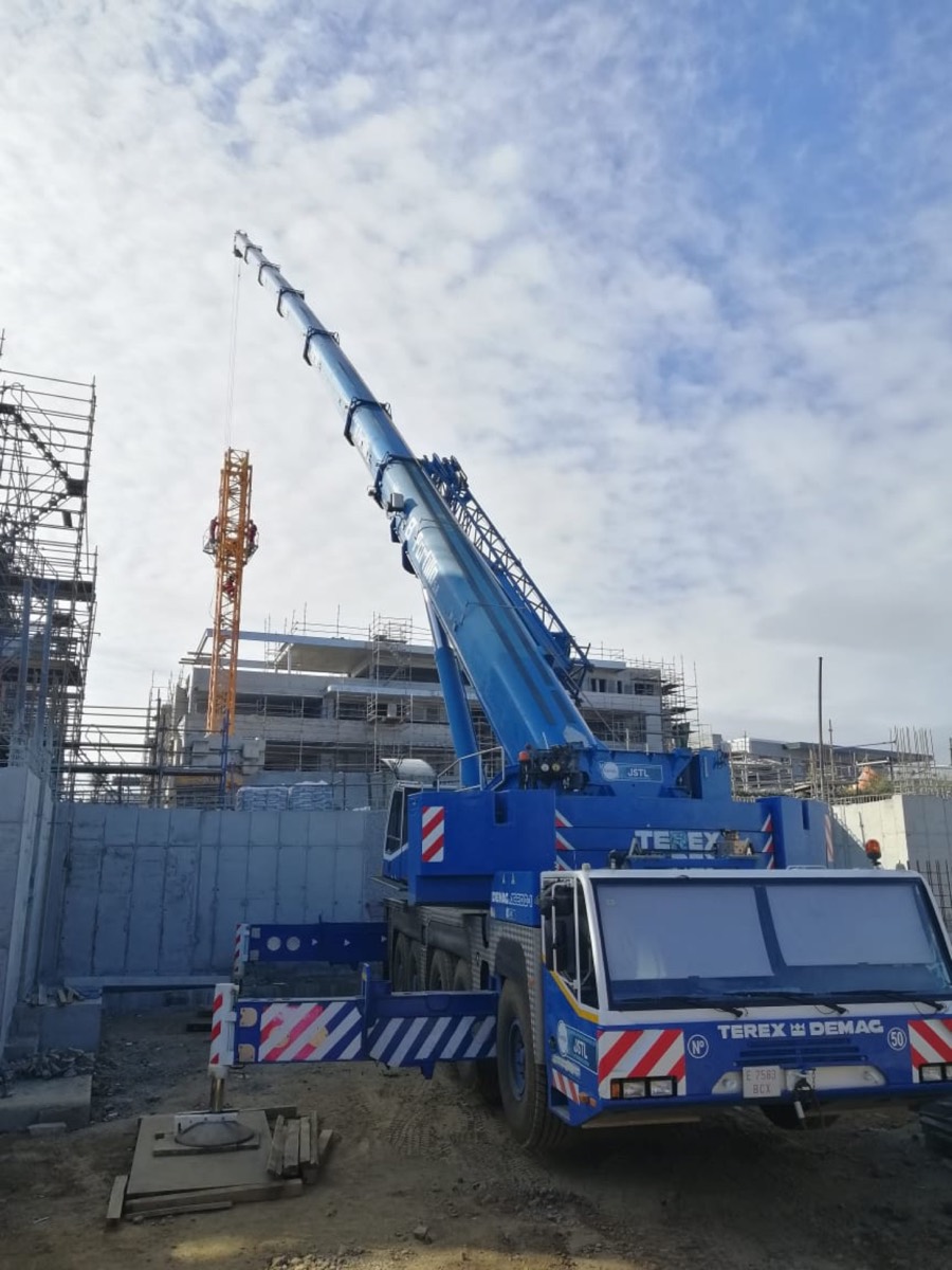 JSTL crane lifting steel on a building site